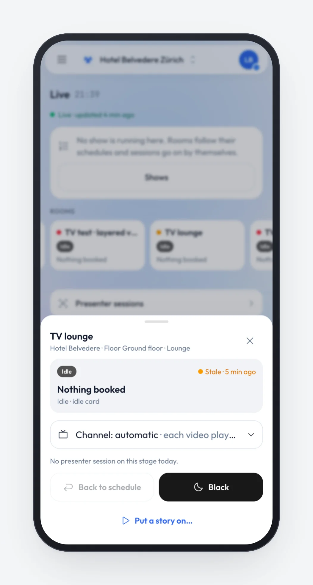 The TV lounge sheet on a phone: status Idle with Nothing booked, the Channel control set to automatic, and Back to schedule, Black and Put a story on actions.
